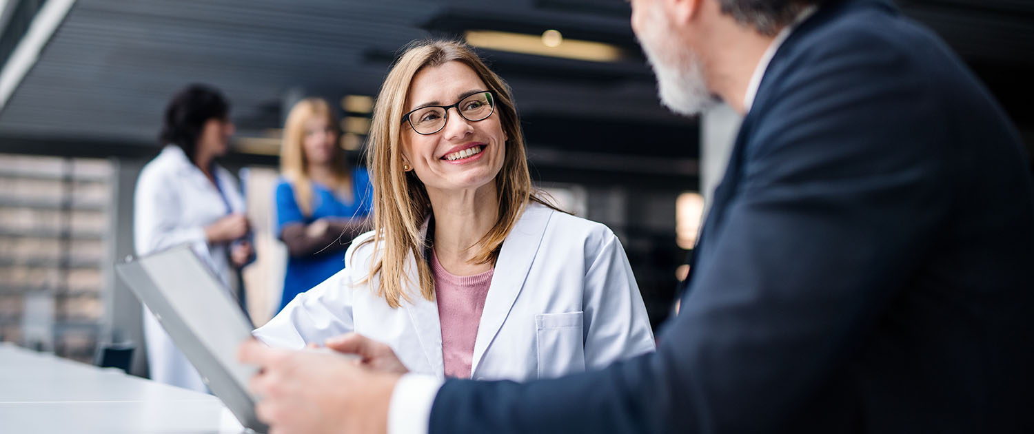 Physician talking to a Smart In Media representative.